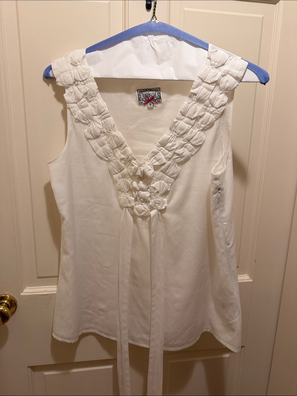 Yoana Baraschi White V-Neck Sleeveless Top with Decorative Bow Trim